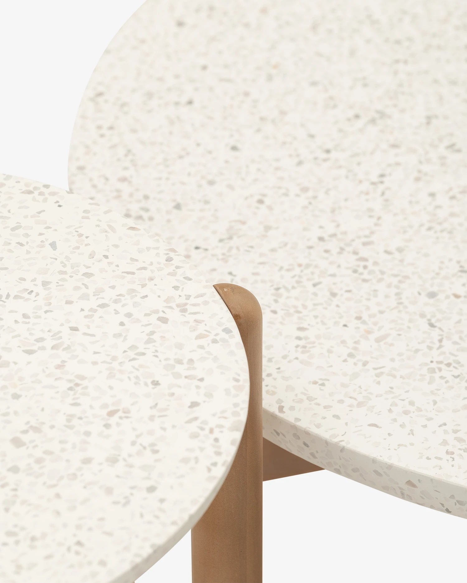 Outdoor tables made of wood and white terrazzo